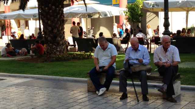 Three men in the square who asked us for tracts