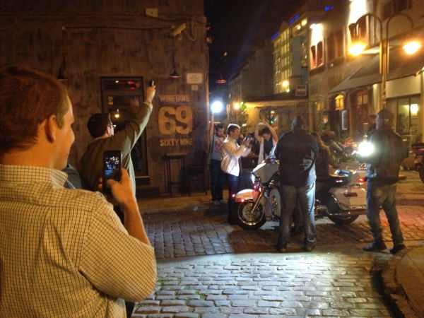 Pretending to photograph the actor